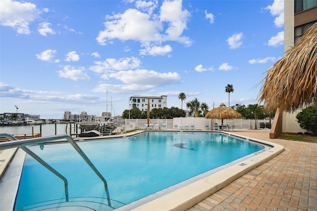 255 Dolphin Pt Unit 207, Clearwater Beach, FL 33767 - community pool featuring a patio area and a water view