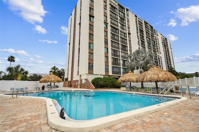255 Dolphin Pt Unit 207, Clearwater Beach, FL 33767 - community pool featuring a patio