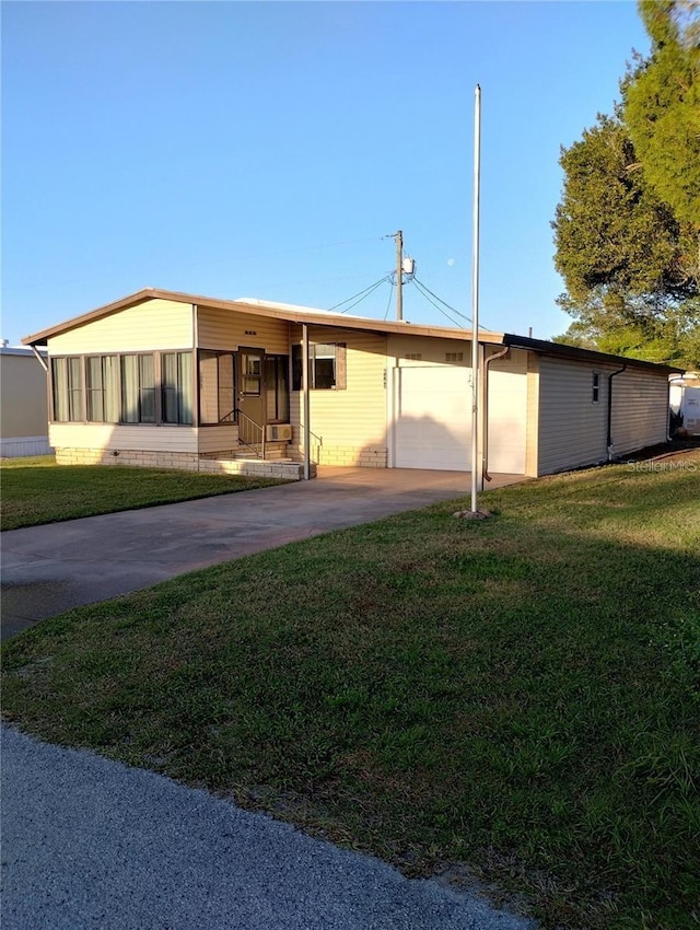 6443 Midland St, Zephyrhills, FL 33542 - view of front of property featuring a front lawn and driveway