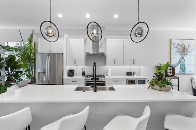 4515 W N A St Unit 6, Tampa, FL 33609 - kitchen with stainless steel fridge, decorative backsplash, white cabinets, a breakfast bar, and recessed lighting