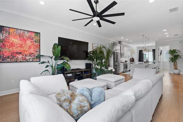 4515 W N A St Unit 6, Tampa, FL 33609 - living room with ceiling fan, recessed lighting, light wood-style flooring, and ornamental molding