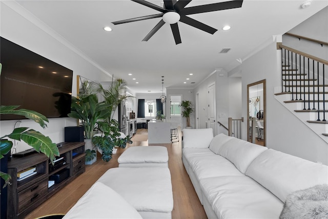 4515 W N A St Unit 6, Tampa, FL 33609 - living area with a ceiling fan, crown molding, wood finished floors, recessed lighting, and stairway