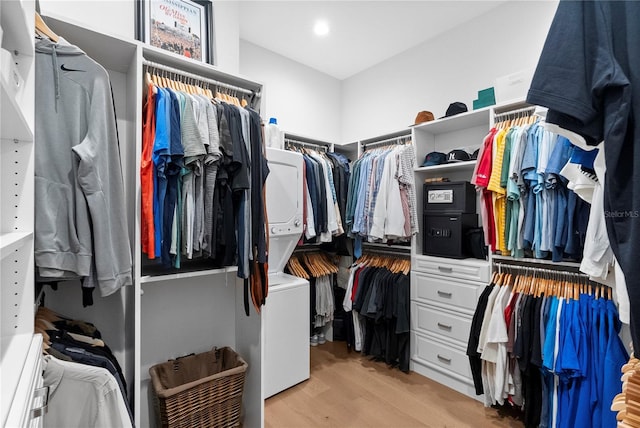 4515 W N A St Unit 6, Tampa, FL 33609 - walk in closet featuring stacked washing machine and dryer and light wood-type flooring