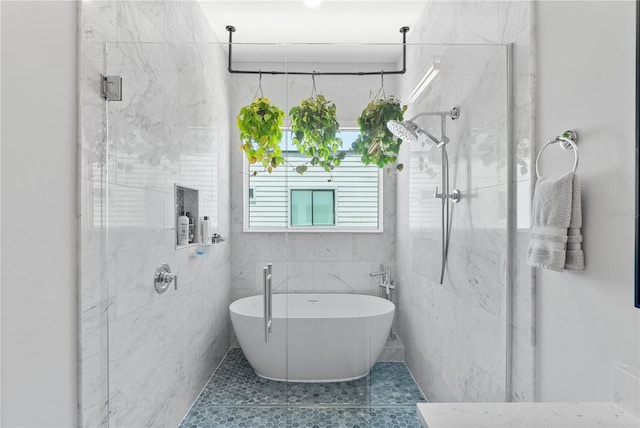 4515 W N A St Unit 6, Tampa, FL 33609 - full bath featuring a marble finish shower, tile patterned floors, a soaking tub, and tile walls