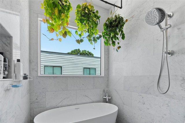 4515 W N A St Unit 6, Tampa, FL 33609 - bathroom featuring tiled shower and a freestanding bath