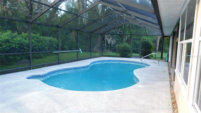 6605 Foxmoor Dr, Zephyrhills, FL 33542 - outdoor pool with a patio and glass enclosure