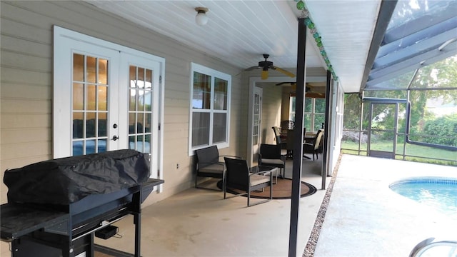 6605 Foxmoor Dr, Zephyrhills, FL 33542 - view of patio with french doors, ceiling fan, an outdoor pool, and a lanai