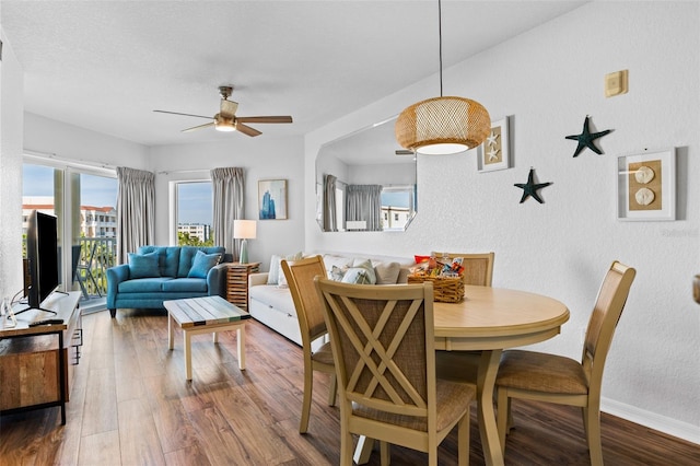 12000 Gulf Blvd Unit 506N, Treasure Island, FL 33706 - dining area with ceiling fan, a textured wall, and wood finished floors