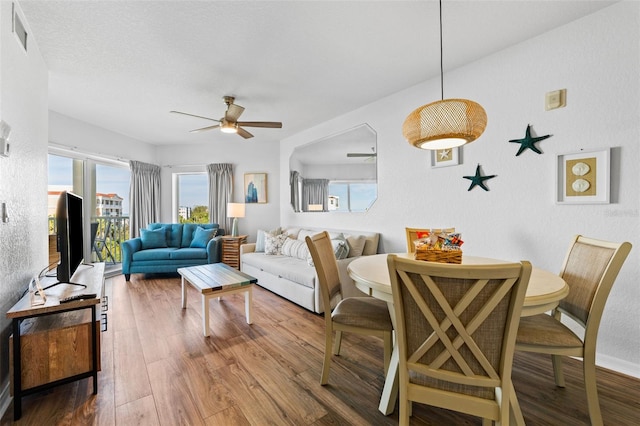 12000 Gulf Blvd Unit 506N, Treasure Island, FL 33706 - living area with ceiling fan and wood finished floors