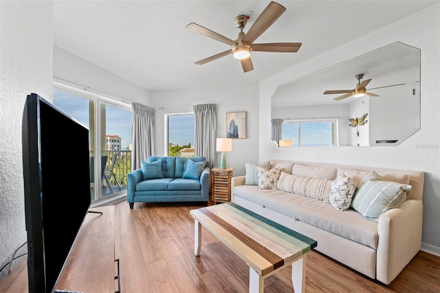 12000 Gulf Blvd Unit 506N, Treasure Island, FL 33706 - living room with a ceiling fan and wood finished floors