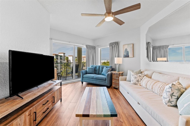 12000 Gulf Blvd Unit 506N, Treasure Island, FL 33706 - living room featuring a ceiling fan and light wood-style floors