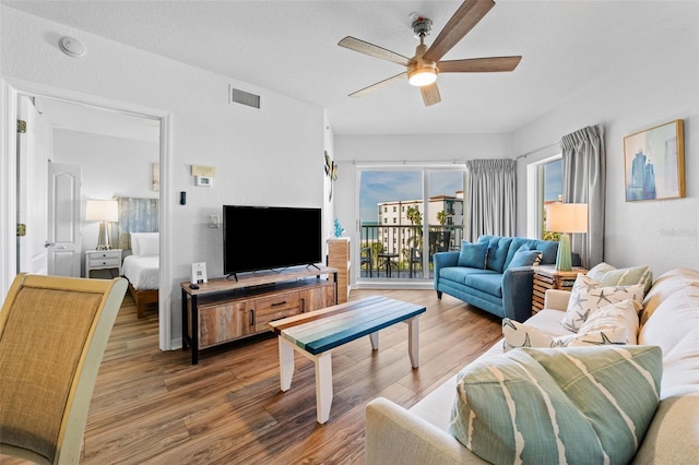 12000 Gulf Blvd Unit 506N, Treasure Island, FL 33706 - living area featuring a ceiling fan and wood finished floors