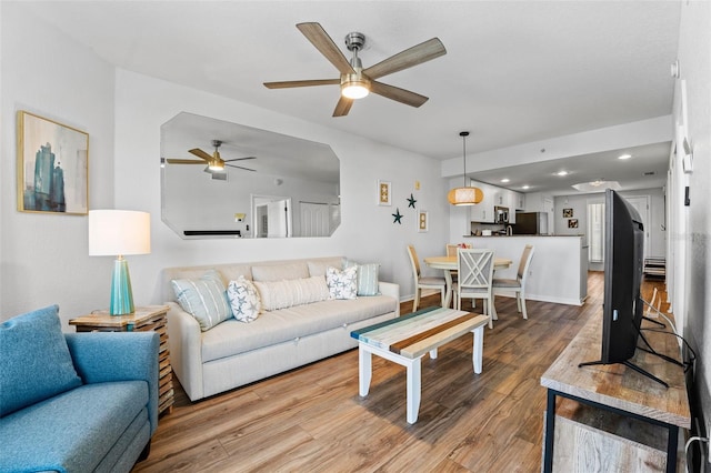 12000 Gulf Blvd Unit 506N, Treasure Island, FL 33706 - living room with a ceiling fan, wood finished floors, and recessed lighting