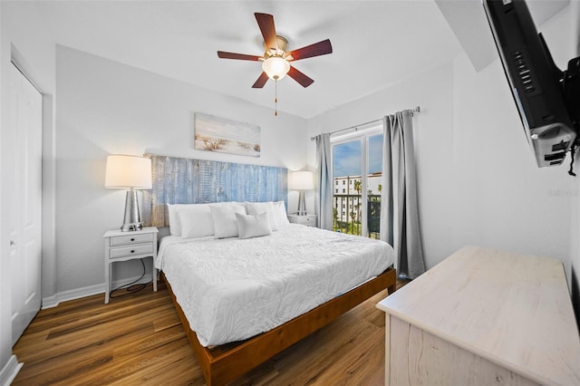 12000 Gulf Blvd Unit 506N, Treasure Island, FL 33706 - bedroom featuring dark wood-type flooring, access to exterior, and a ceiling fan
