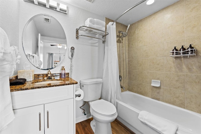 12000 Gulf Blvd Unit 506N, Treasure Island, FL 33706 - full bath featuring wood finished floors, shower / tub combo with curtain, vanity, and a ceiling fan