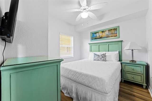 12000 Gulf Blvd Unit 506N, Treasure Island, FL 33706 - bedroom with dark wood-style floors and a ceiling fan