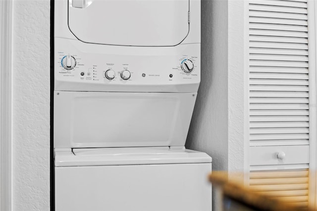 12000 Gulf Blvd Unit 506N, Treasure Island, FL 33706 - laundry room with stacked washing machine and dryer and a textured wall