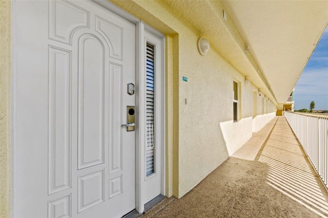12000 Gulf Blvd Unit 506N, Treasure Island, FL 33706 - entrance to property with stucco siding and a balcony