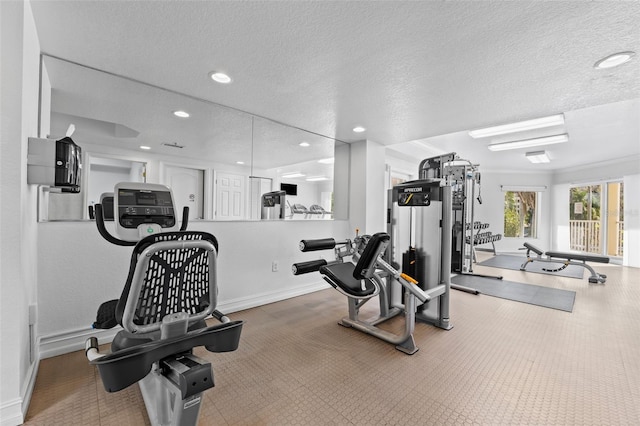 12000 Gulf Blvd Unit 506N, Treasure Island, FL 33706 - gym featuring a textured ceiling and recessed lighting