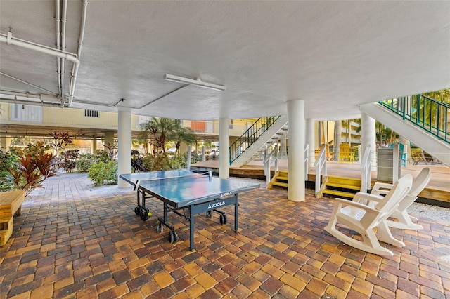 12000 Gulf Blvd Unit 506N, Treasure Island, FL 33706 - view of patio / terrace featuring stairway and outdoor dining area