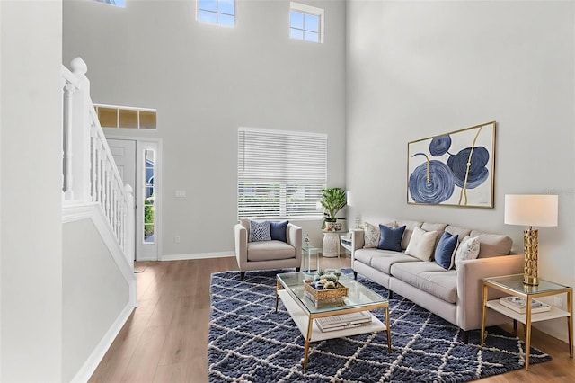 5015 58th Ter E, Bradenton, FL 34203 - living room featuring a high ceiling, wood finished floors, and stairs