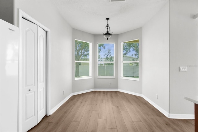 5015 58th Ter E, Bradenton, FL 34203 - unfurnished dining area with plenty of natural light and wood finished floors