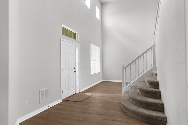 5015 58th Ter E, Bradenton, FL 34203 - entryway featuring healthy amount of natural light, wood finished floors, stairway, and a high ceiling