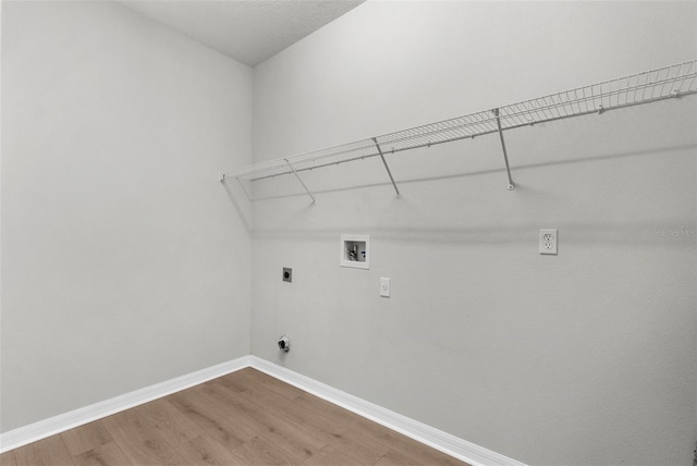 5015 58th Ter E, Bradenton, FL 34203 - laundry area featuring electric dryer hookup, wood finished floors, and washer hookup
