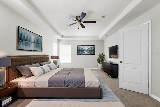 5015 58th Ter E, Bradenton, FL 34203 - bedroom with a tray ceiling, carpet flooring, and a ceiling fan