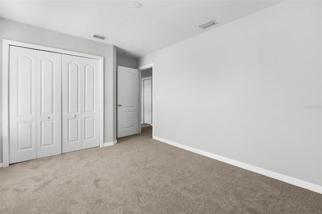 5015 58th Ter E, Bradenton, FL 34203 - unfurnished bedroom with carpet flooring and a closet