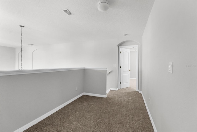5015 58th Ter E, Bradenton, FL 34203 - hallway with carpet flooring and a textured ceiling