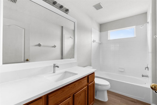 5015 58th Ter E, Bradenton, FL 34203 - full bath featuring vanity, wood finished floors, and tub / shower combination