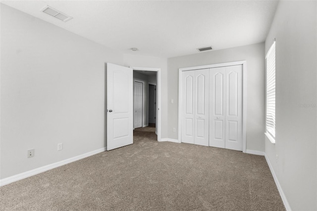 5015 58th Ter E, Bradenton, FL 34203 - unfurnished bedroom featuring carpet and a closet