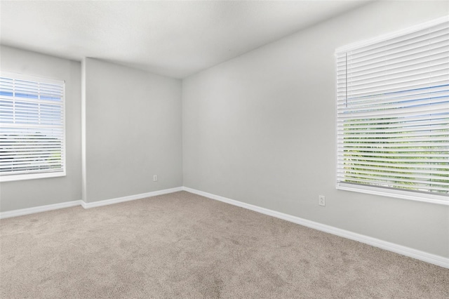 5015 58th Ter E, Bradenton, FL 34203 - spare room featuring carpet flooring and baseboards