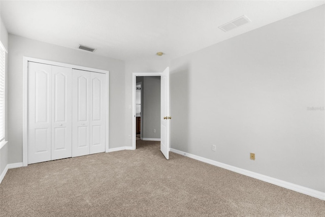 5015 58th Ter E, Bradenton, FL 34203 - unfurnished bedroom featuring carpet flooring and a closet