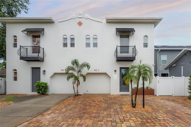 403 S Fremont Ave Unit 3, Tampa, FL 33606 - view of front of home with a balcony, stucco siding, and driveway