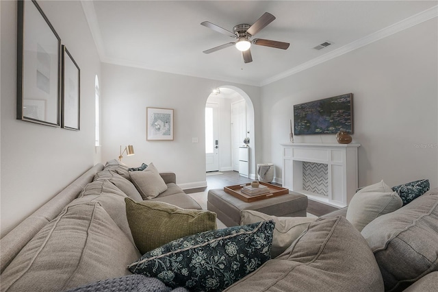 403 S Fremont Ave Unit 3, Tampa, FL 33606 - living room with arched walkways, ceiling fan, ornamental molding, and wood finished floors
