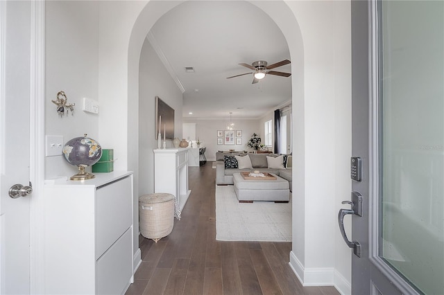 403 S Fremont Ave Unit 3, Tampa, FL 33606 - foyer entrance featuring arched walkways, dark wood finished floors, a ceiling fan, and ornamental molding
