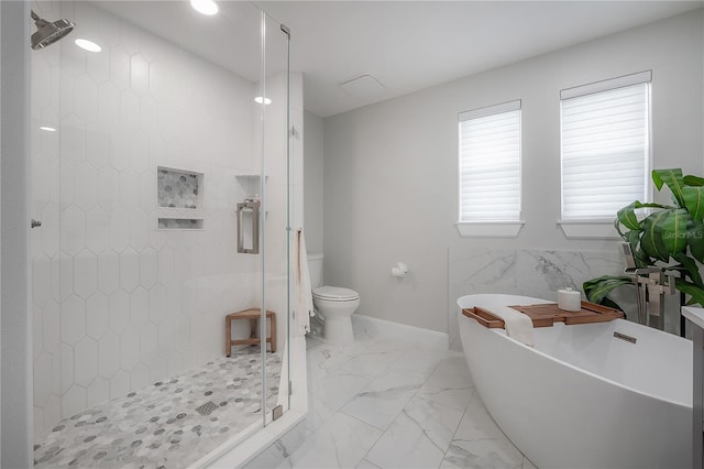 403 S Fremont Ave Unit 3, Tampa, FL 33606 - bathroom with a shower stall, a freestanding tub, and marble finish flooring