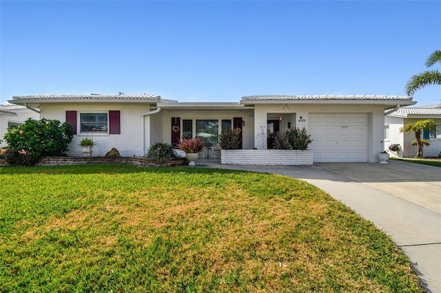 9548 141st St, Seminole, FL 33776 - ranch-style house with stucco siding, driveway, an attached garage, and a front yard