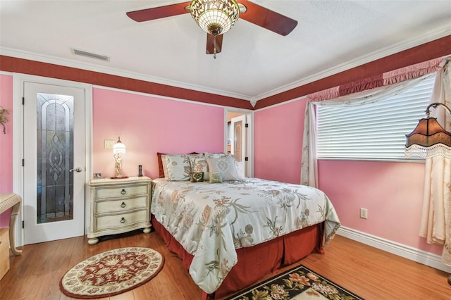 9548 141st St, Seminole, FL 33776 - bedroom featuring wood finished floors, crown molding, and ceiling fan