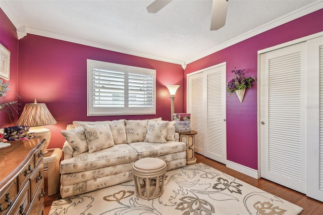 9548 141st St, Seminole, FL 33776 - living area featuring ornamental molding, ceiling fan, wood finished floors, and a textured ceiling
