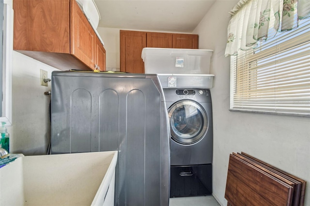 9548 141st St, Seminole, FL 33776 - washroom featuring cabinet space and washer / dryer
