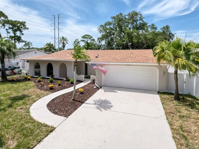 603 Ivey Ln, Tarpon Springs, FL 34689 - single story home with an attached garage, concrete driveway, and stucco siding