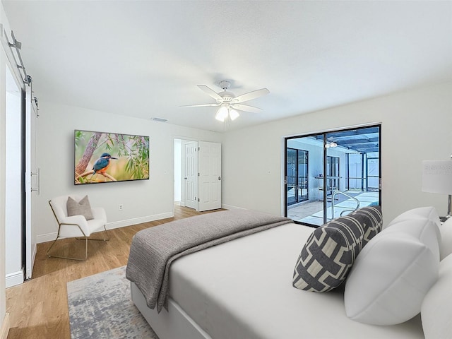 603 Ivey Ln, Tarpon Springs, FL 34689 - bedroom with access to exterior, light wood-style flooring, a sunroom, and a ceiling fan