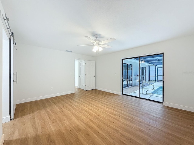 603 Ivey Ln, Tarpon Springs, FL 34689 - empty room with ceiling fan and light wood-style flooring