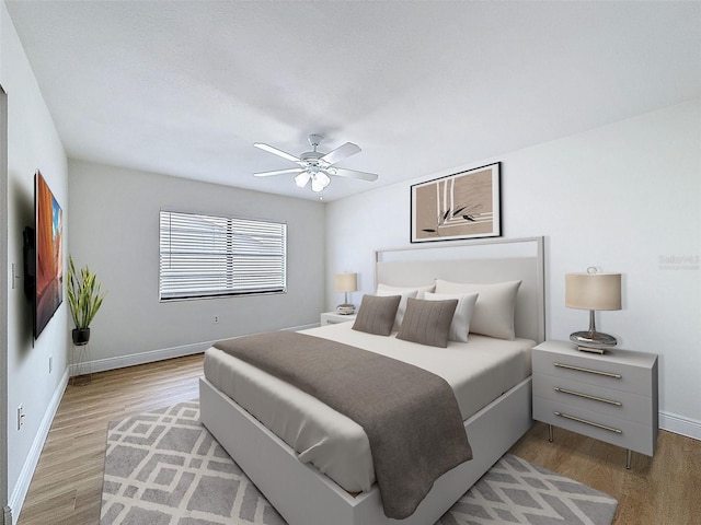 603 Ivey Ln, Tarpon Springs, FL 34689 - bedroom with light wood-style flooring and ceiling fan