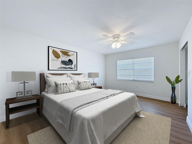 603 Ivey Ln, Tarpon Springs, FL 34689 - bedroom with wood finished floors and a ceiling fan