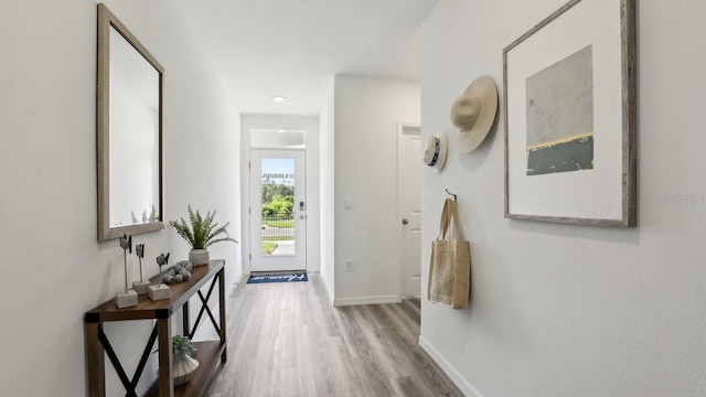 4338 Sand Dollar Way, Zephyrhills, FL 33541 - hallway featuring wood finished floors and baseboards