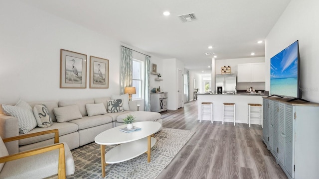 4338 Sand Dollar Way, Zephyrhills, FL 33541 - living area with light wood finished floors and recessed lighting